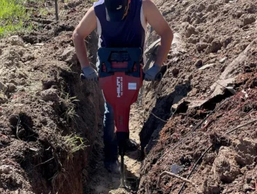 Man excavating for electrical lines